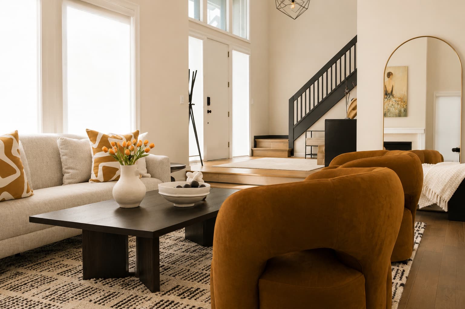 Family room interior design showing well-placed single chairs alongside a longer sofa