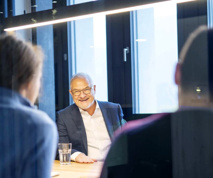 PHENOGY co-founder in conversation at a meeting table