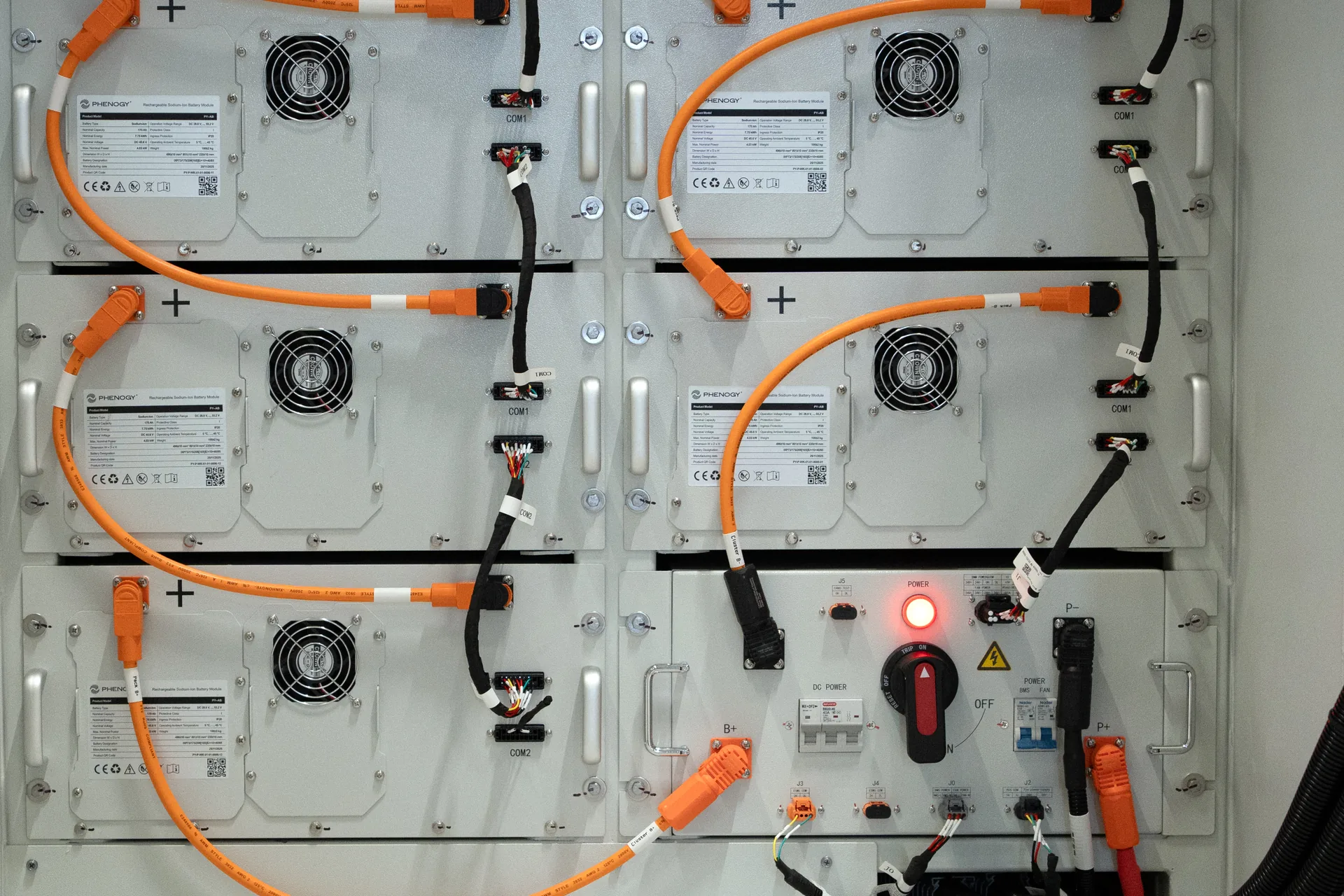 PHENOGY battery modules mounted in a rack with DC cabling and a main power switch
