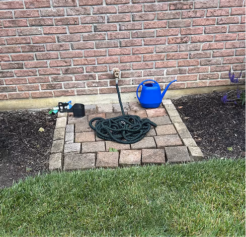 Brick pad with hose and water can