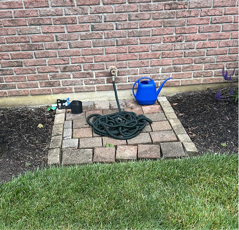 Brick pad with hose and water can