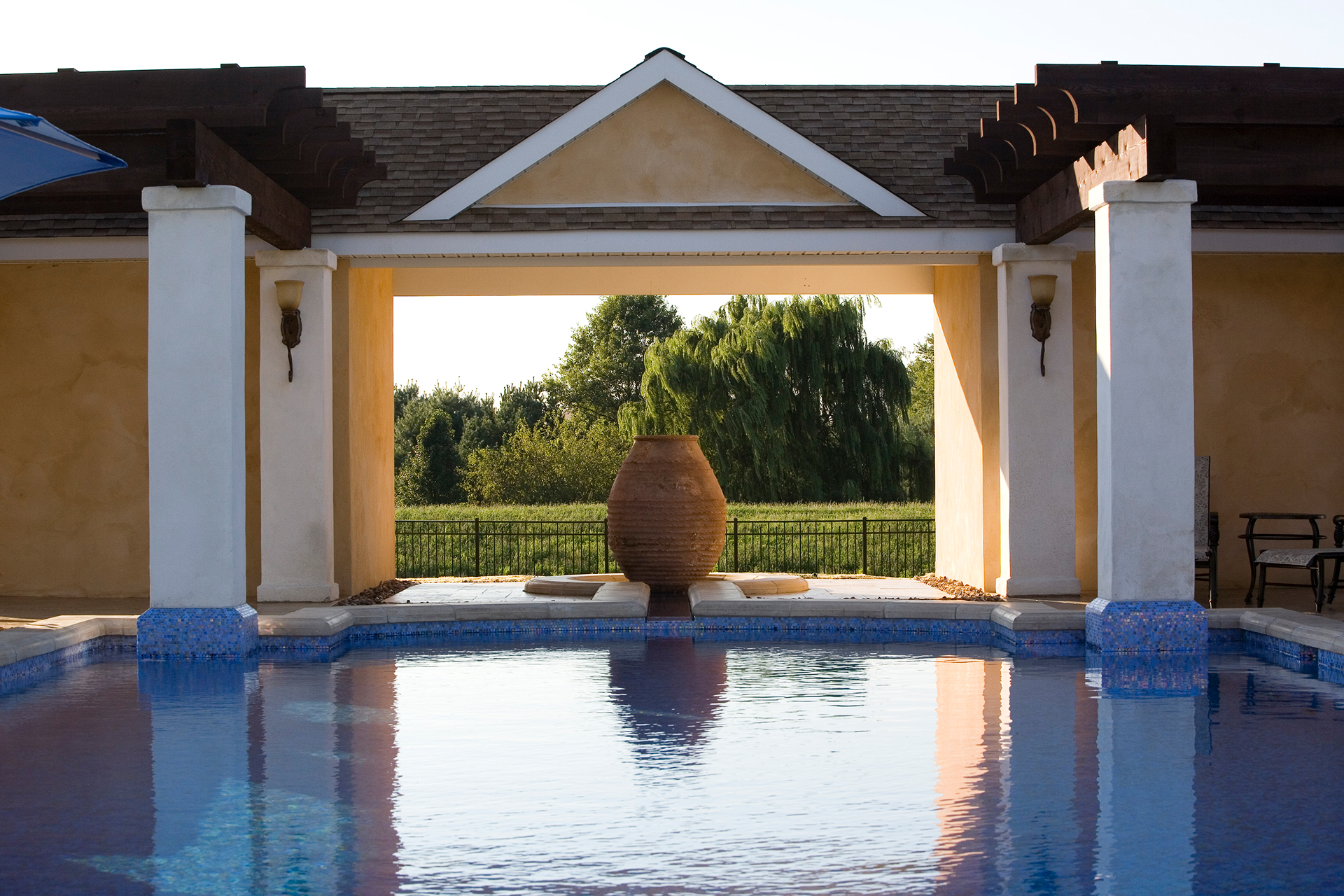 Coping and narrow-tiled channel detail highlighting refined craftsmanship on a Newtown, PA luxury pool.