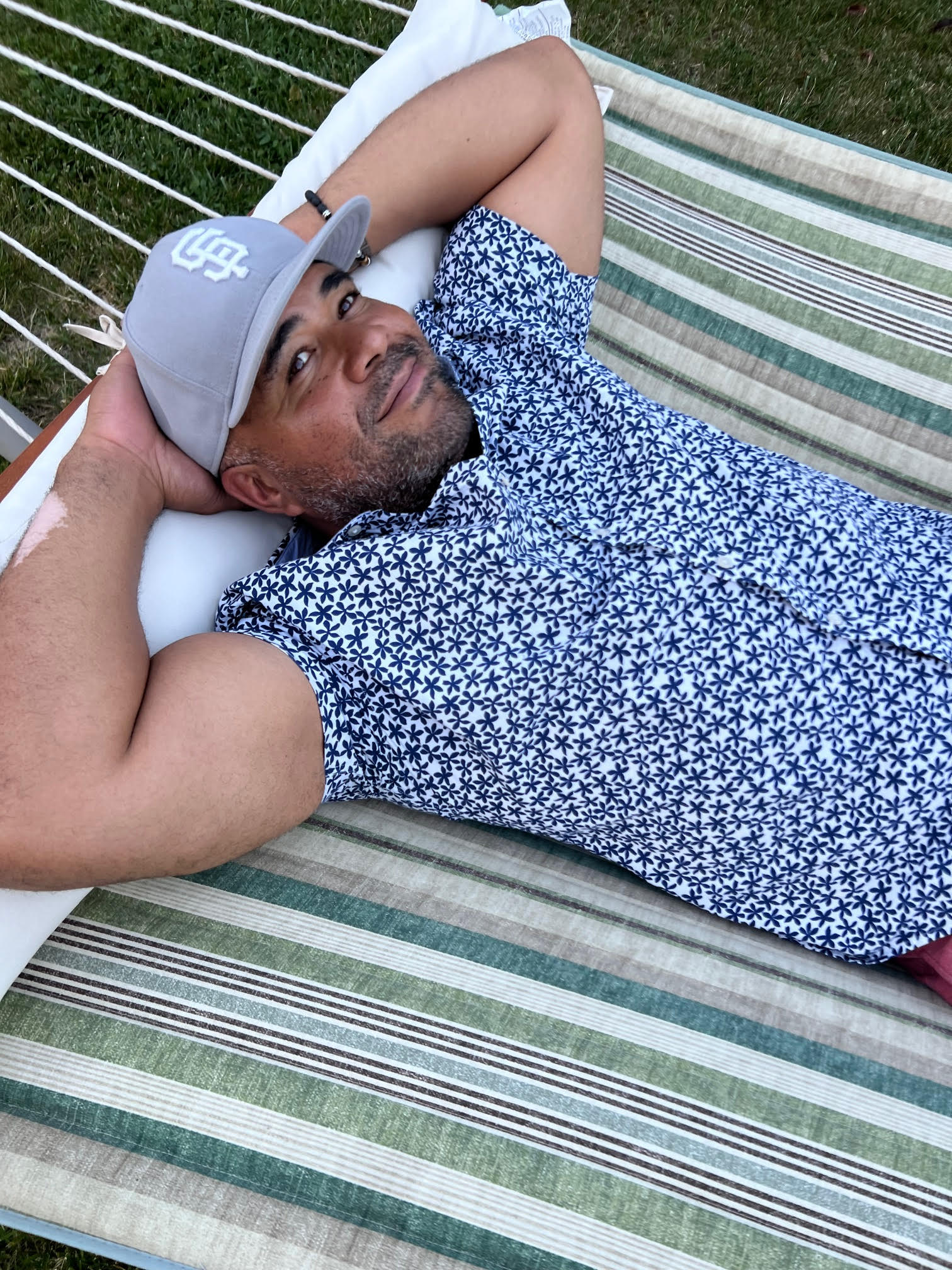 CQ, CEO of Hunky Monk is relaxed and laying back in a hammock 