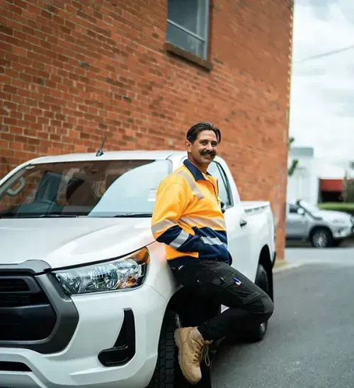 Standing in front of KINTO Ute car hire