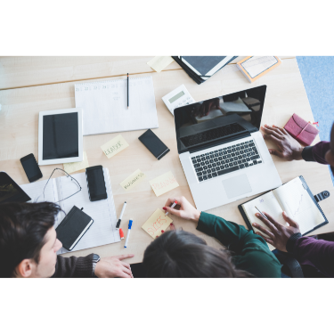Group of people working on a project in the same space and computer