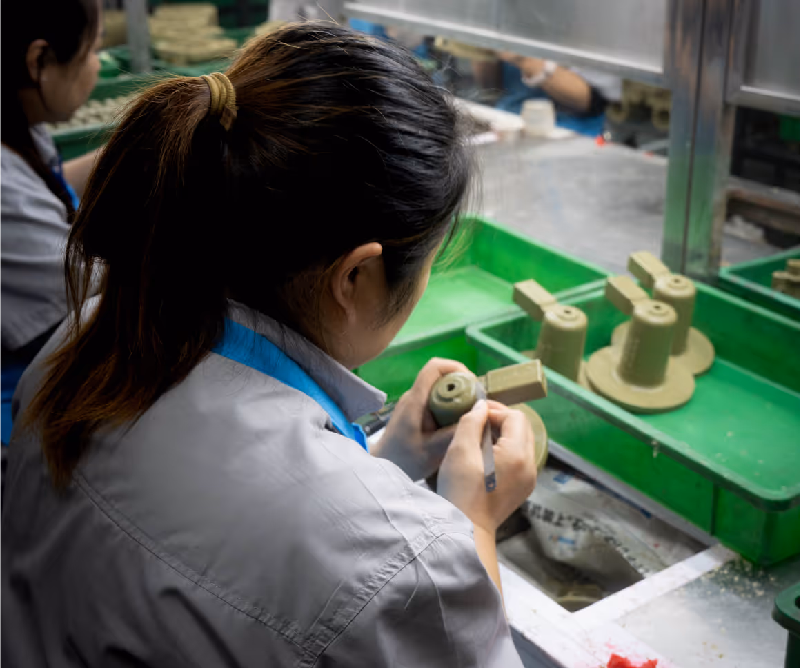 An individual inspecting a part