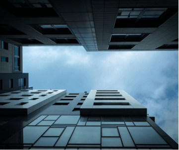 A tall building with a sky in the background.