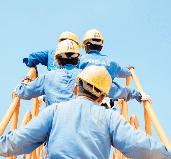 A group of men standing on top of a wooden structure.