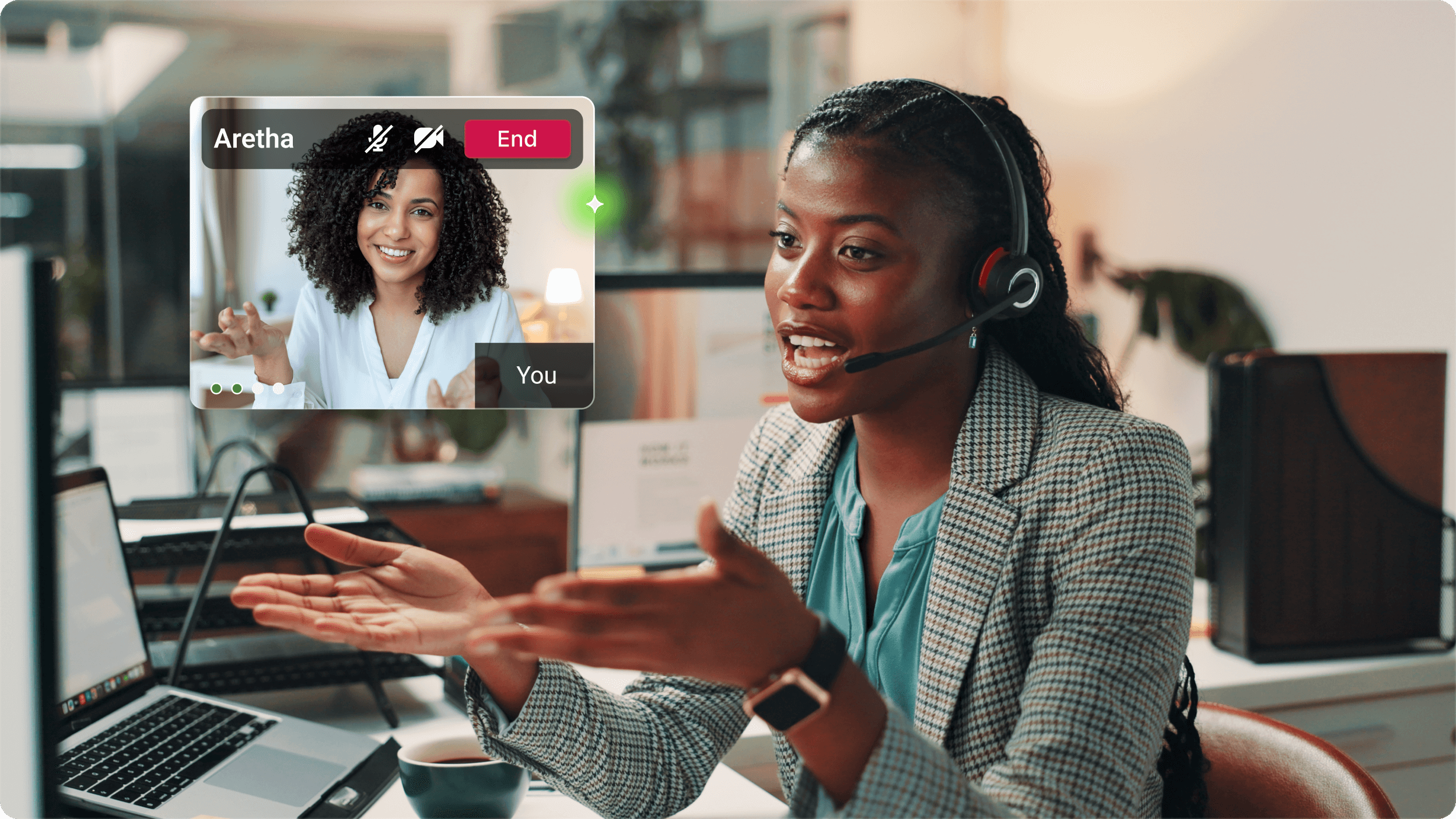 A woman in a headset is engaged in a video call at her desk. A smaller screen shows another woman smiling. The scene conveys professionalism and engagement.