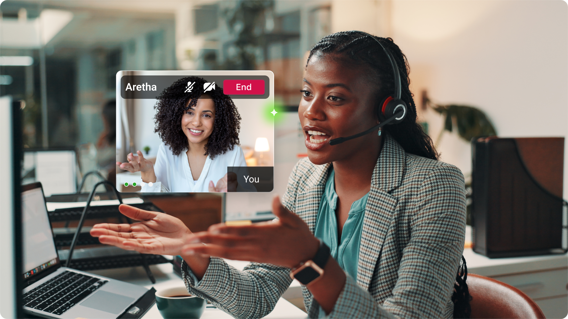 A woman in a headset is engaged in a video call at her desk in virtual bank environment. A smaller screen shows another woman smiling. 