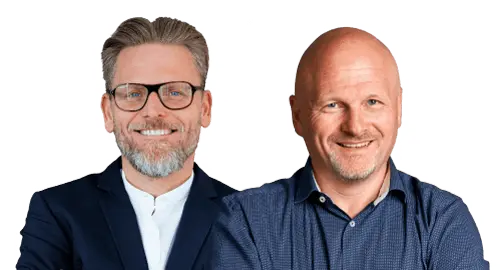 Klaus Dotzler (Finecom GmbH) steht vor Thomas Finke (B + S Logistik GmbH), beide in einer lockeren aber professionellen Pose und im Anzug und Hemd.