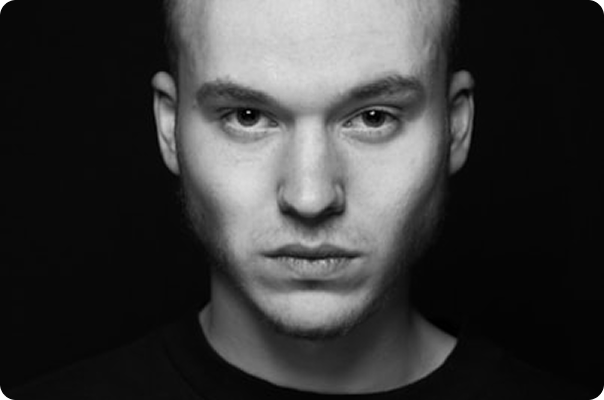 Black and white portrait of a person looking directly at camera