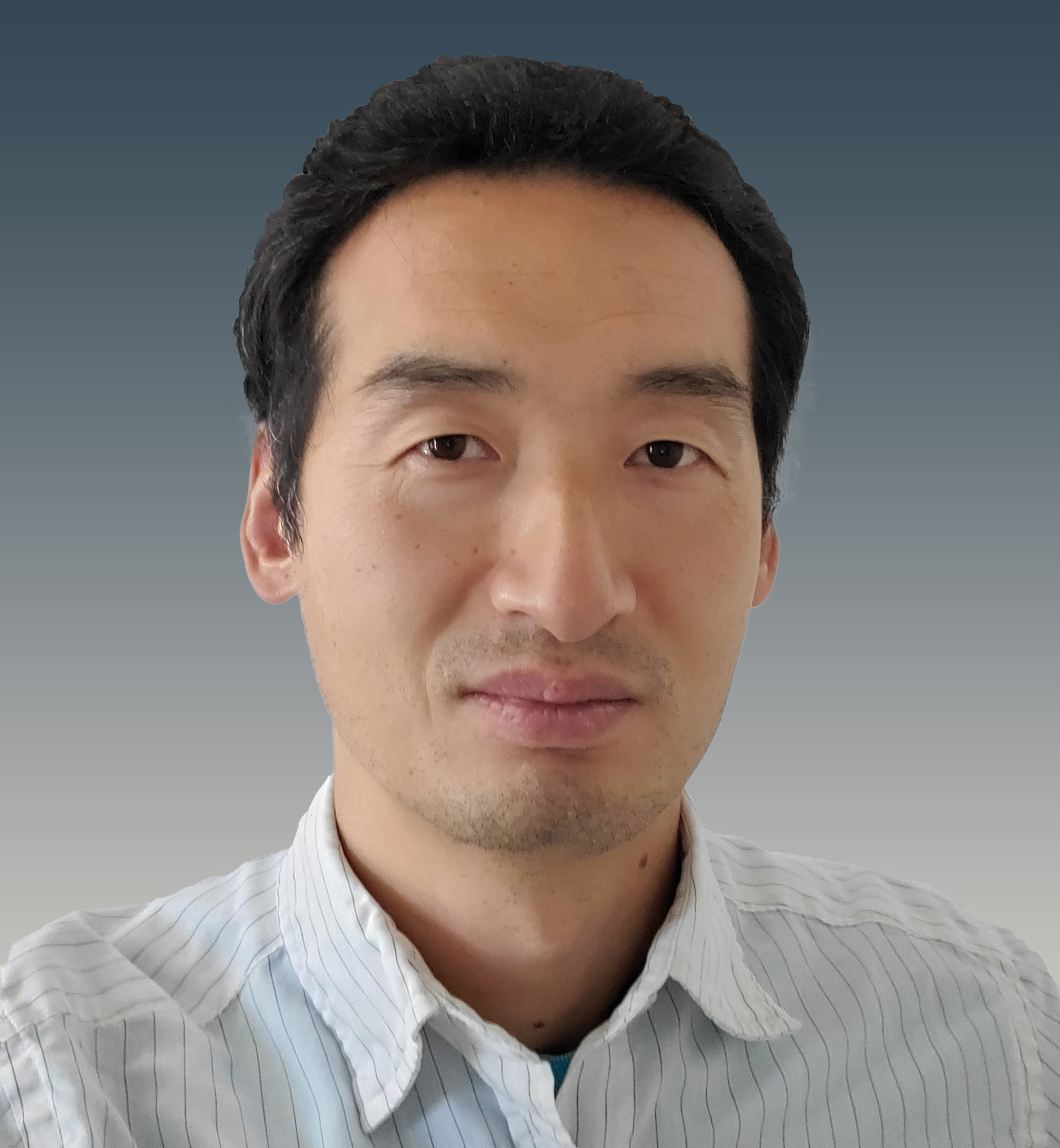 Professional headshot of a person in a striped white button-up shirt