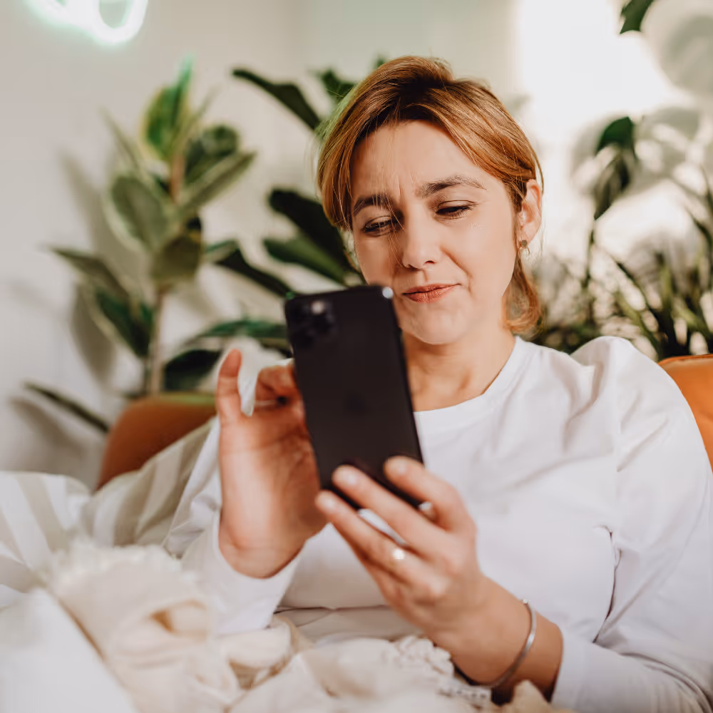 woman looking at mobile emergency profile
