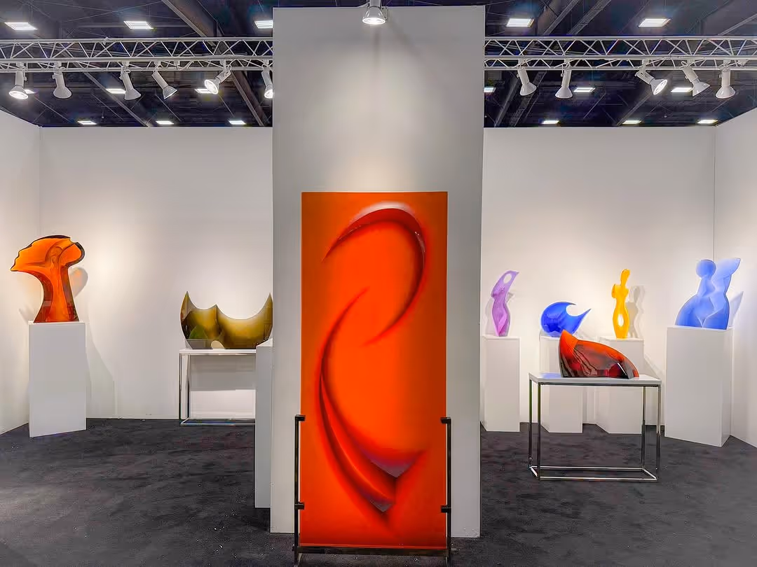 Red Decorative glass panel showcased in a gallery with other glass sculptures
