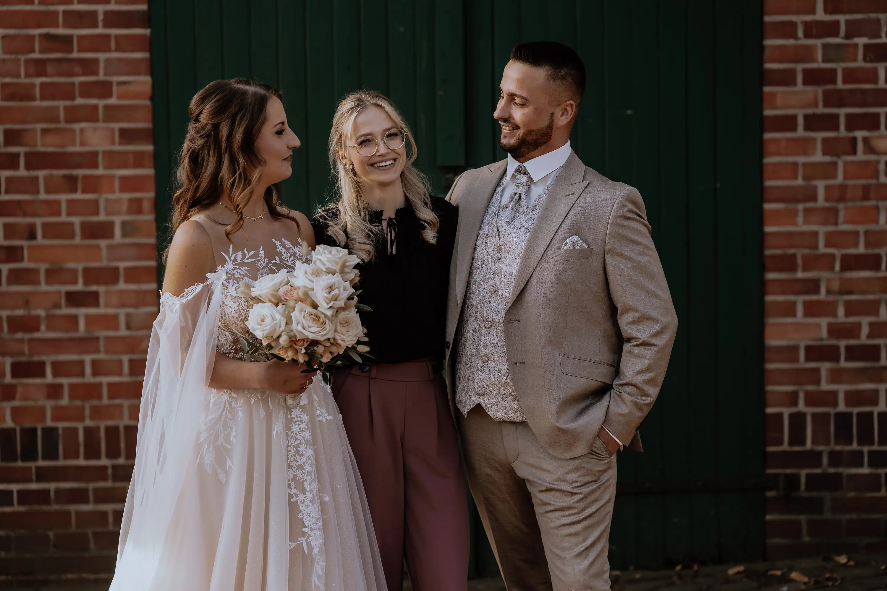 Man and woman in wedding clothes and wedding planer