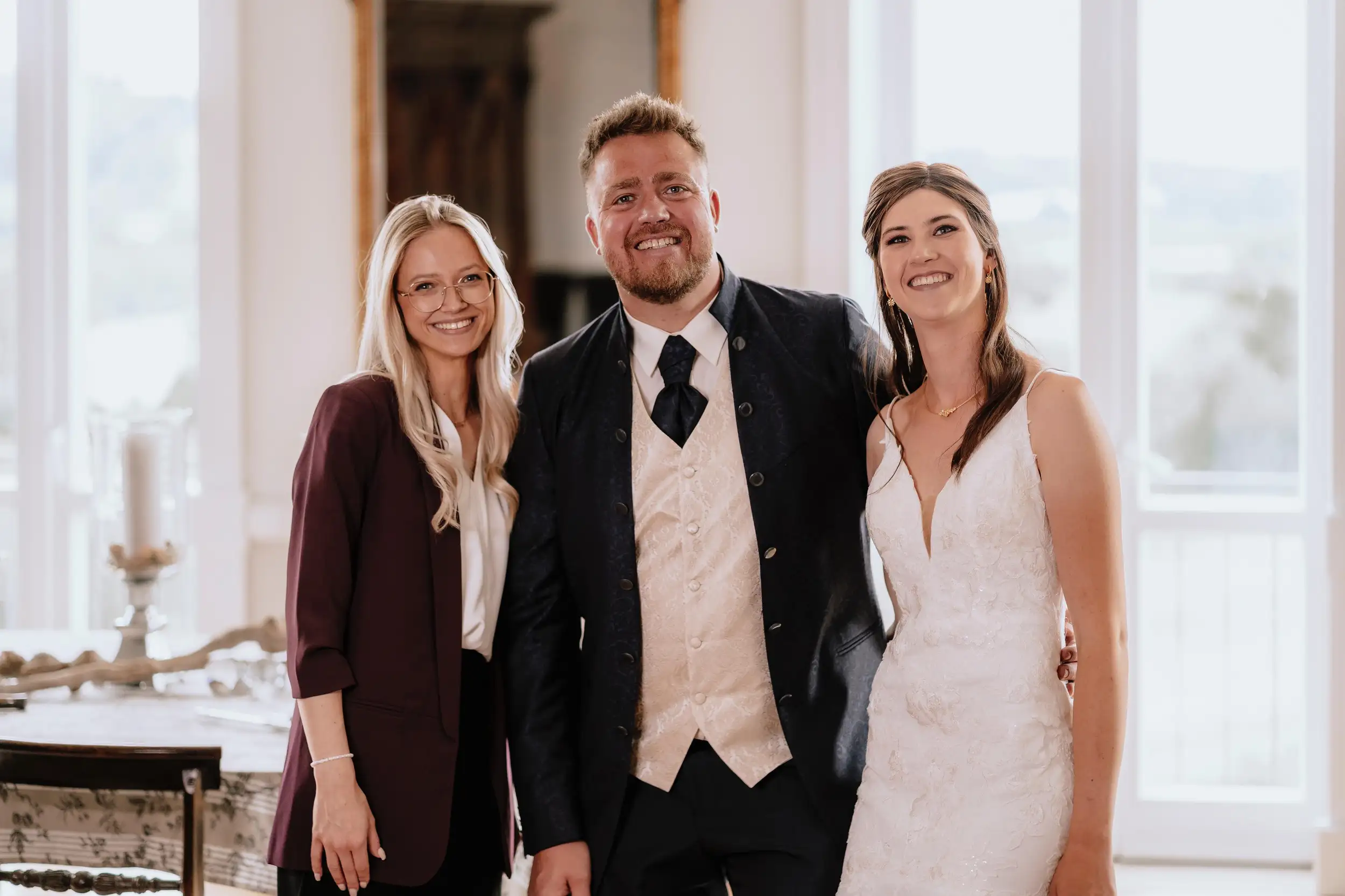 Man and woman in wedding clothes and wedding planer