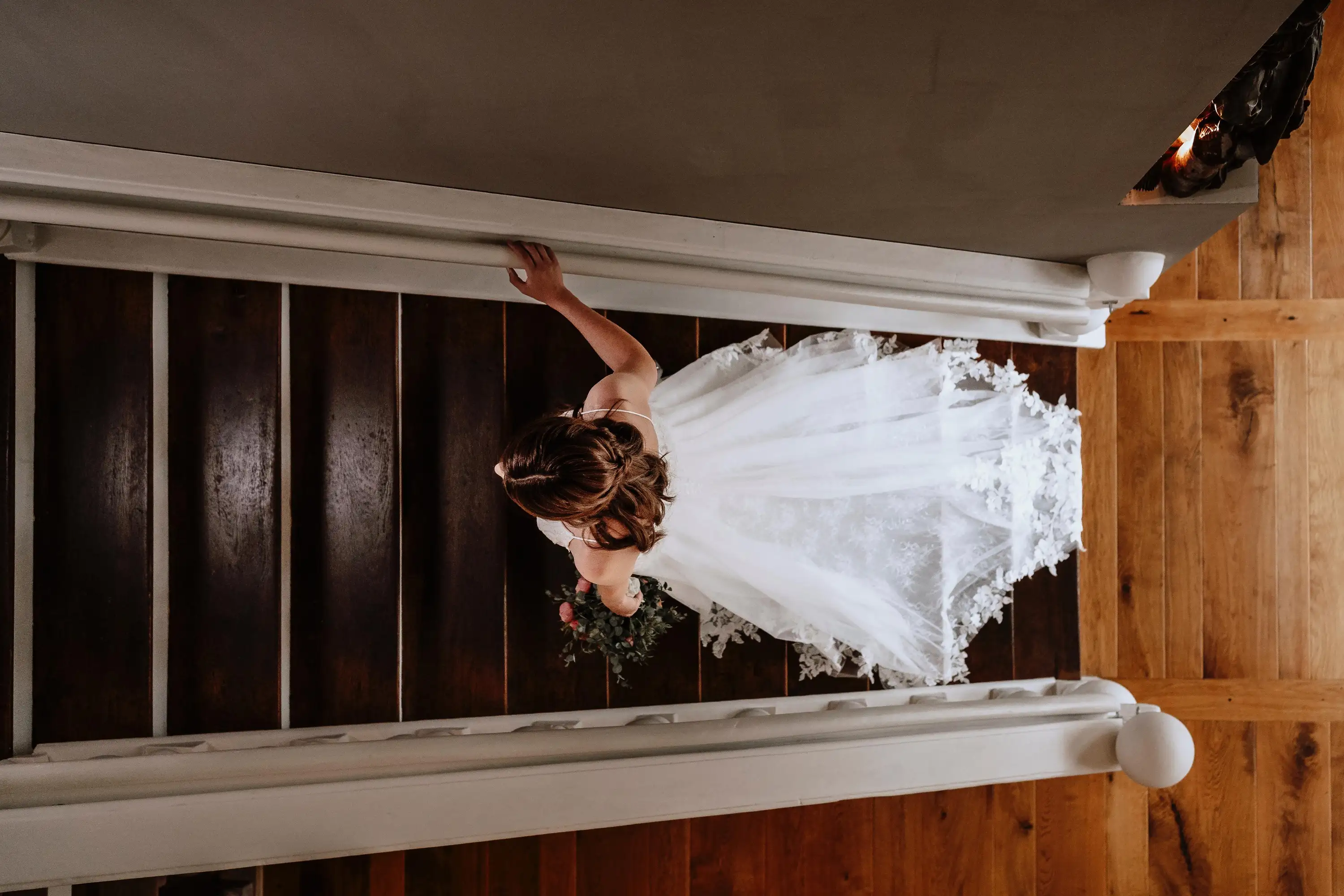 woman in wedding clothes going stairs up