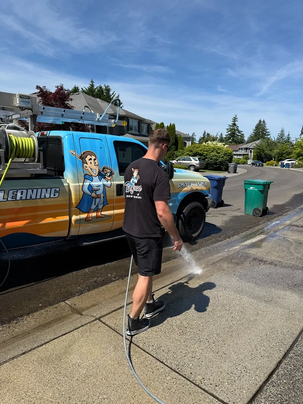 Refyne Window Cleaning professional pressure washing a residential driveway
