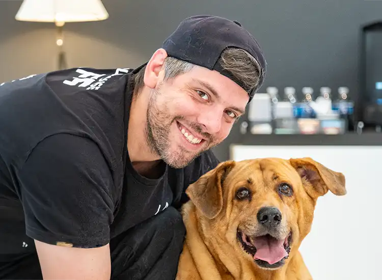 Happy pet owner and his pet at Surgipet