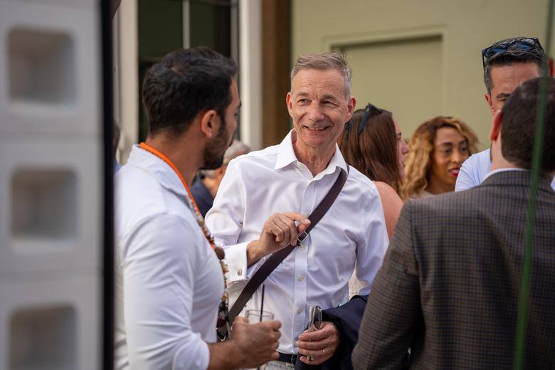 Guests sharing a laugh at an A305 event