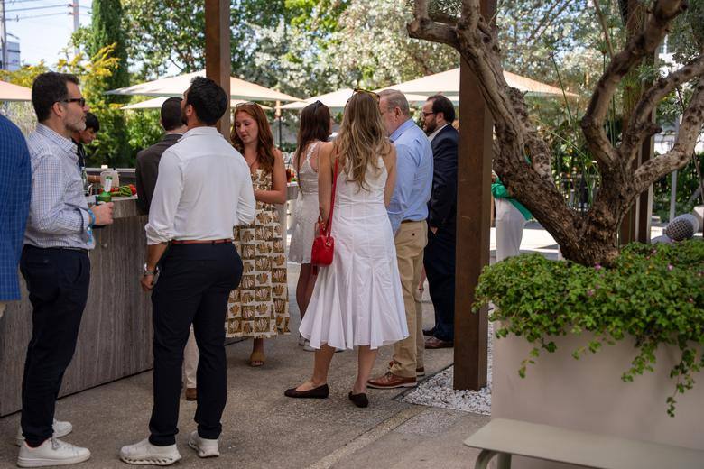 The courtyard busy with guests at an A305 gathering