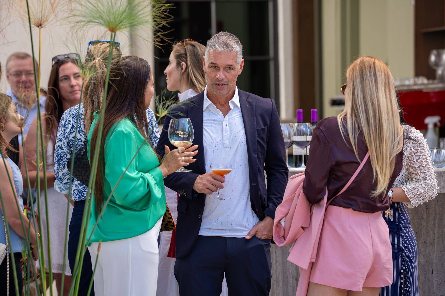 Guests in conversation over cocktails at an A305 gathering