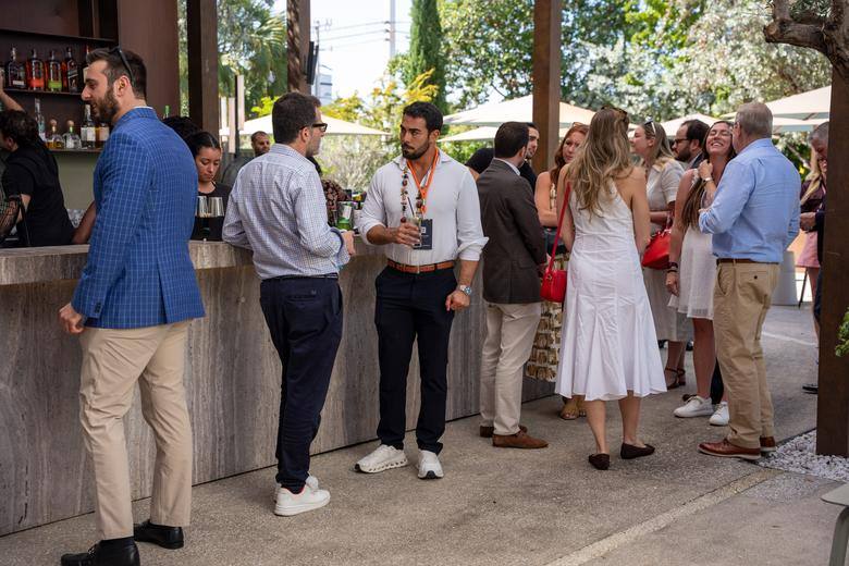 Guests mingling at the bar during an A305 event