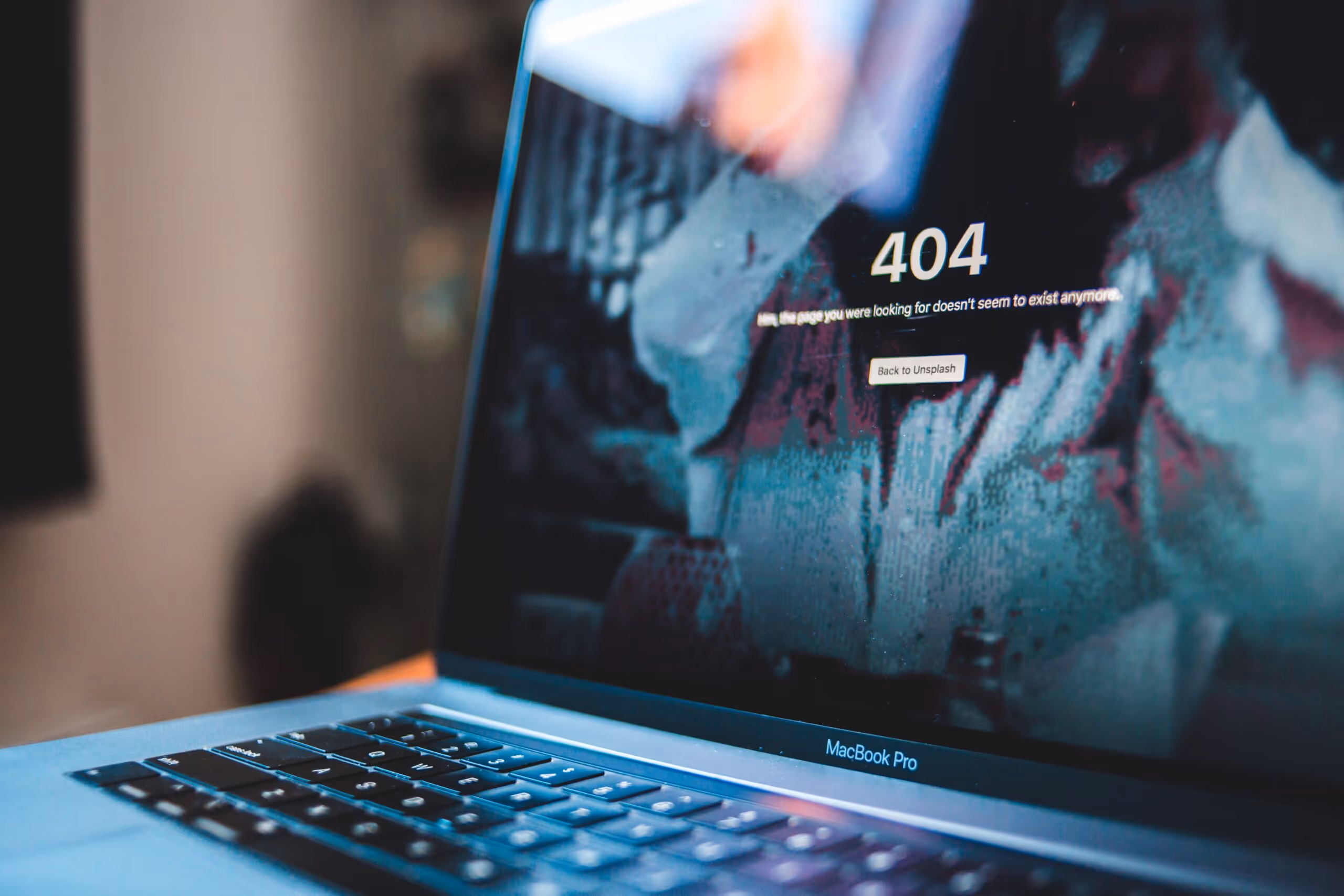 A webpage showing a 404 error on a laptop