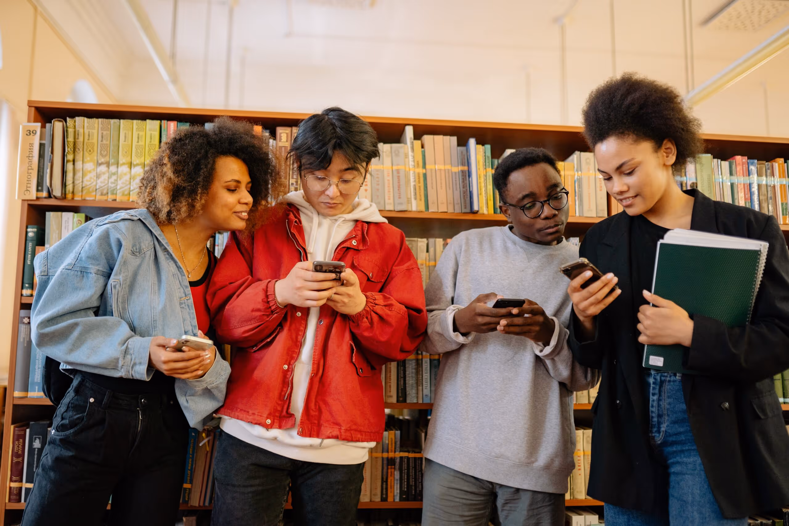 A group of people using smartphones