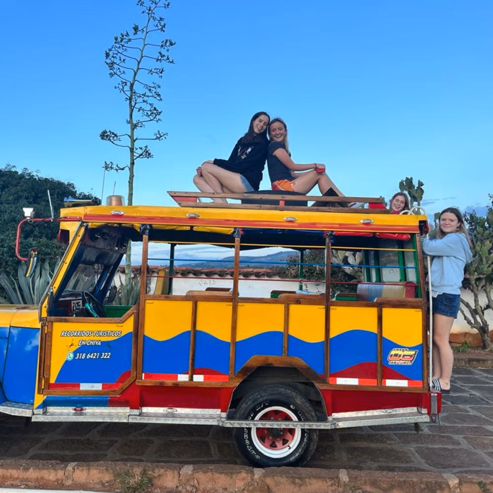 gap year volunteering abroad colombia teens on coloured bus