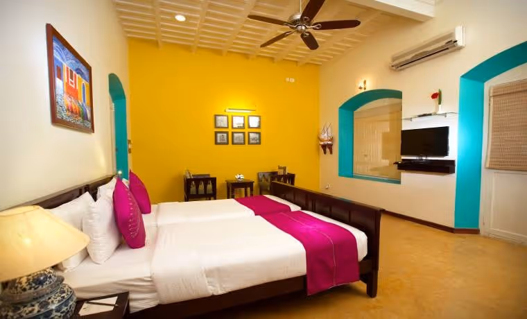 solo travel women south india colourful bedroom accommodation