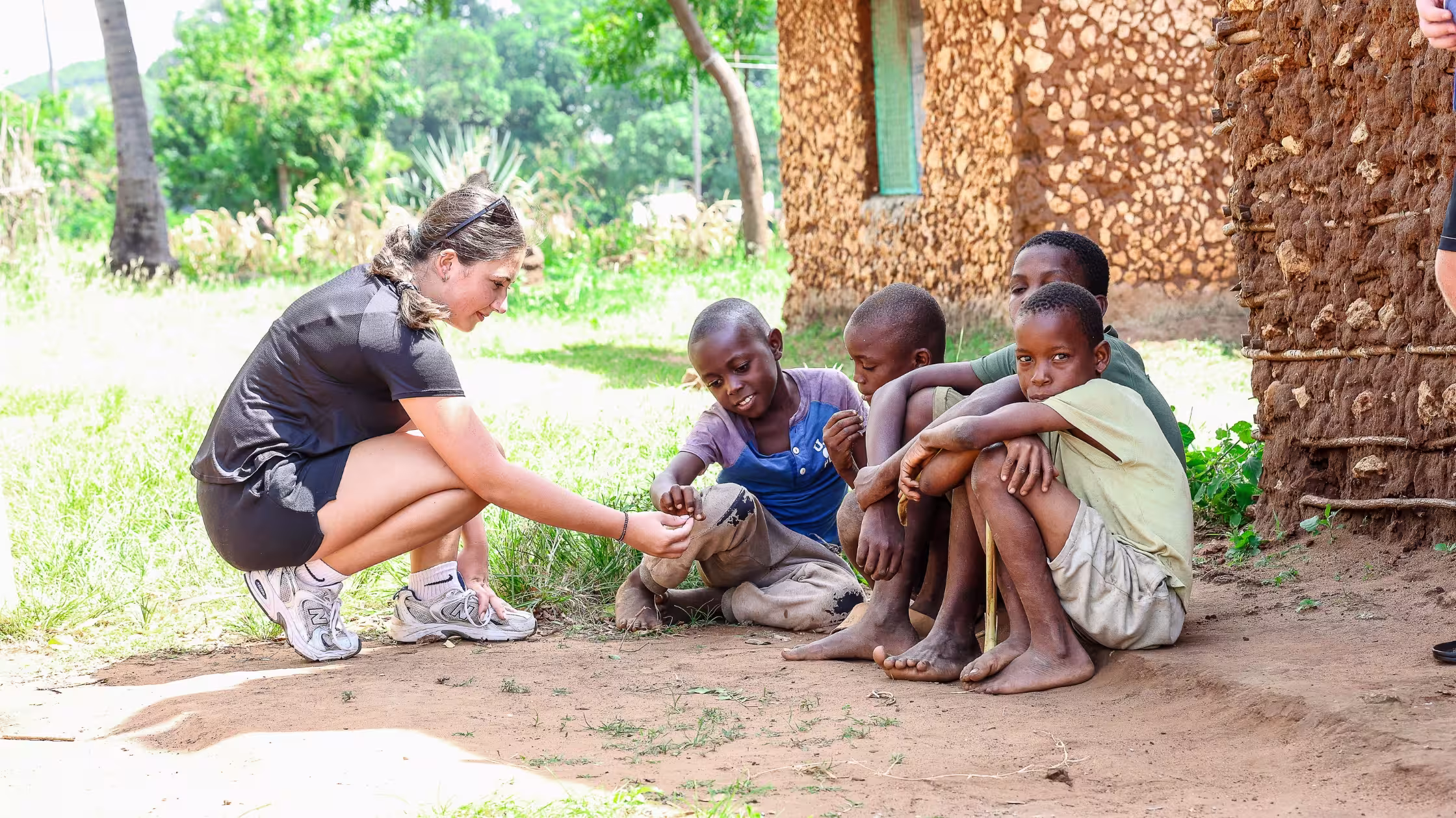 Gap year student communicating with kids during a Leap project abroad.