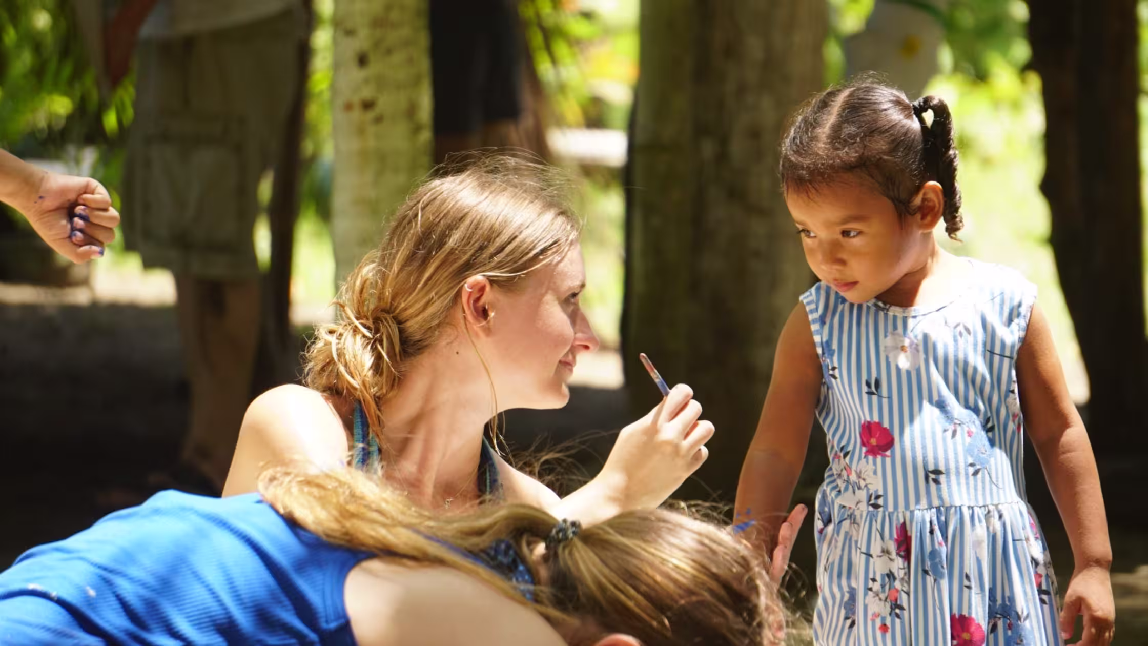 Gap year students communicating with local students.