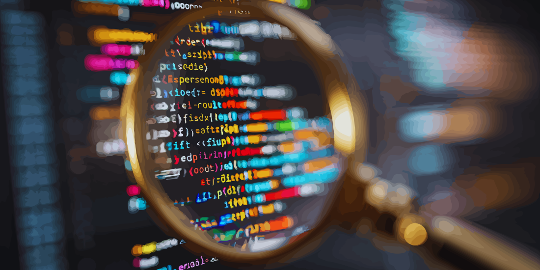 A magnifying glass is held up to lines of code on a computer screen.