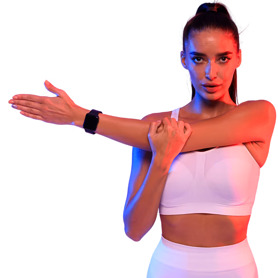 Woman in white sportswear stretching her arm across her chest with red and blue lighting.