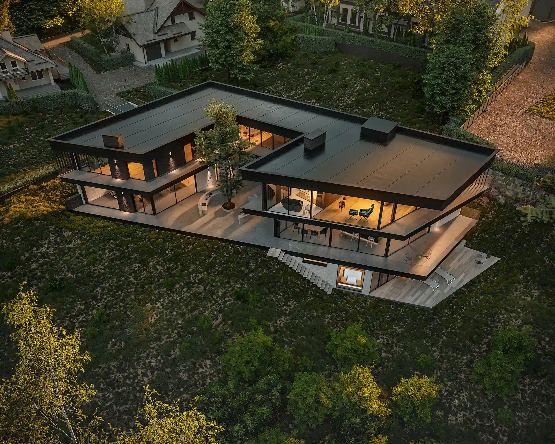 Arkitekttegnet bolig med flatt tak og L-form, tilpasset skrånende tomt, sett ovenfra i skumringen
