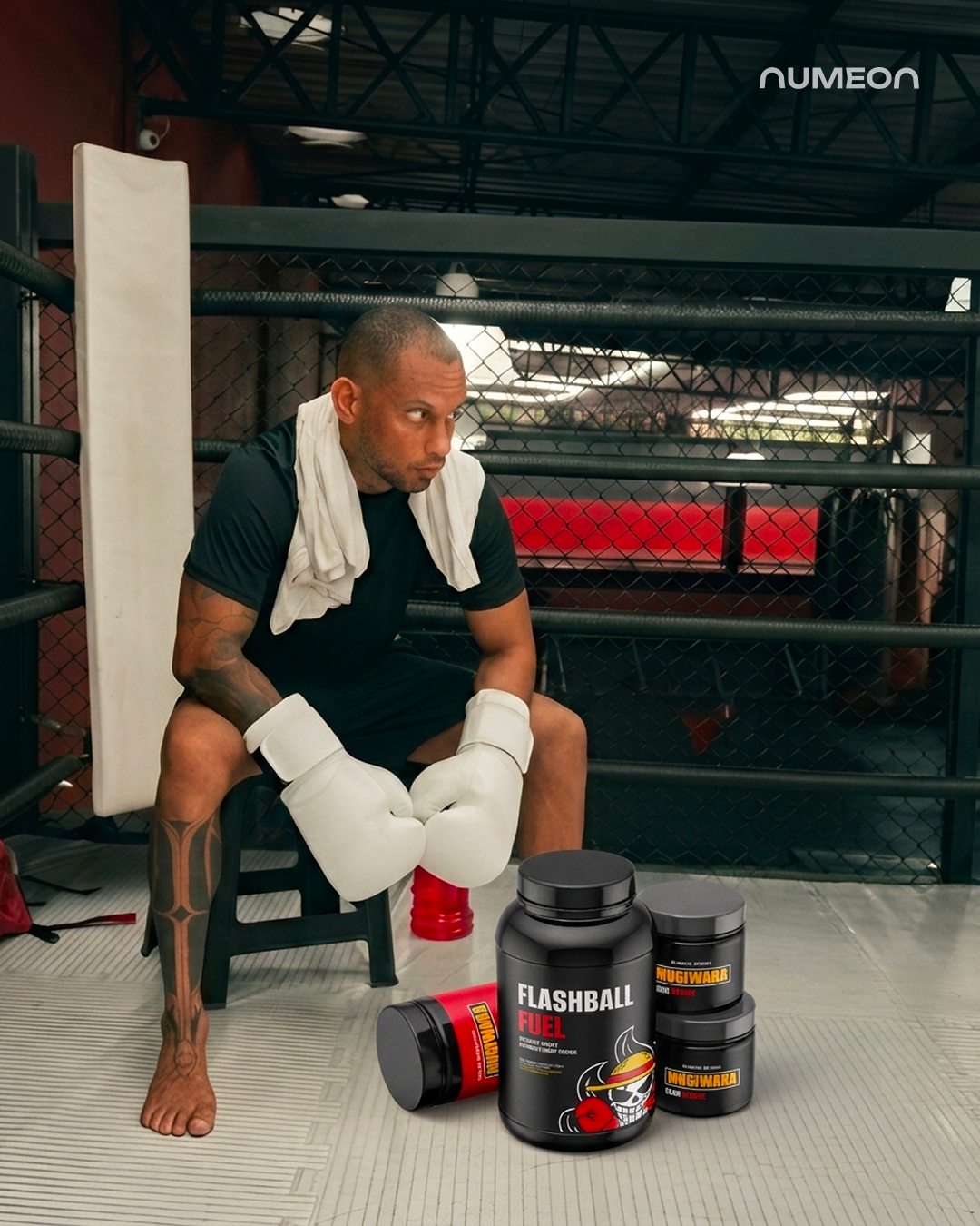 MMA athlete with branded protein supplement boxes featuring the logo