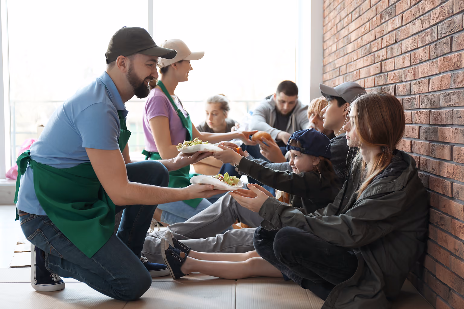 Voltuneers giving food packages to needy