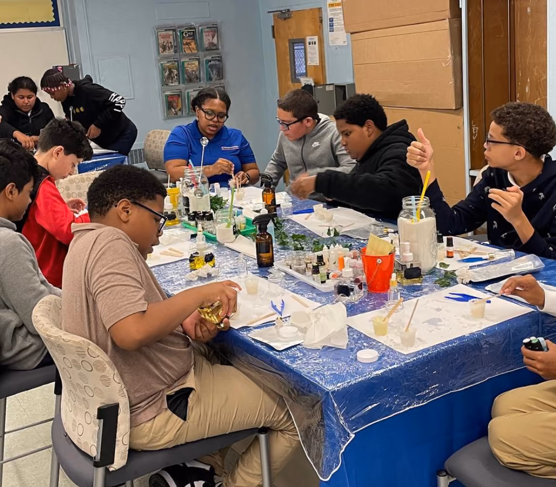 Students and instructor mixing ingredients during a hands-on science activity