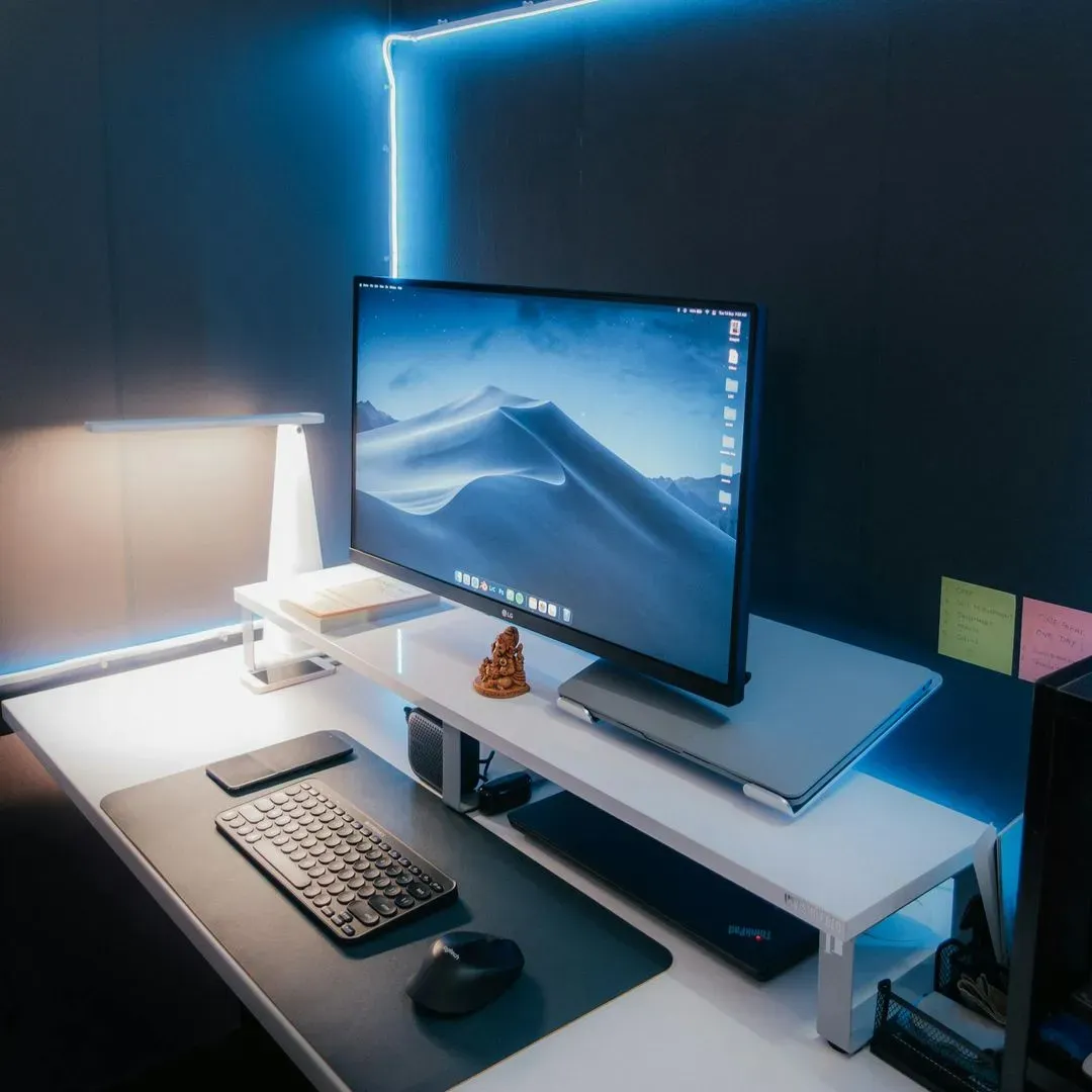 Desktop setup with monitor and lamp.