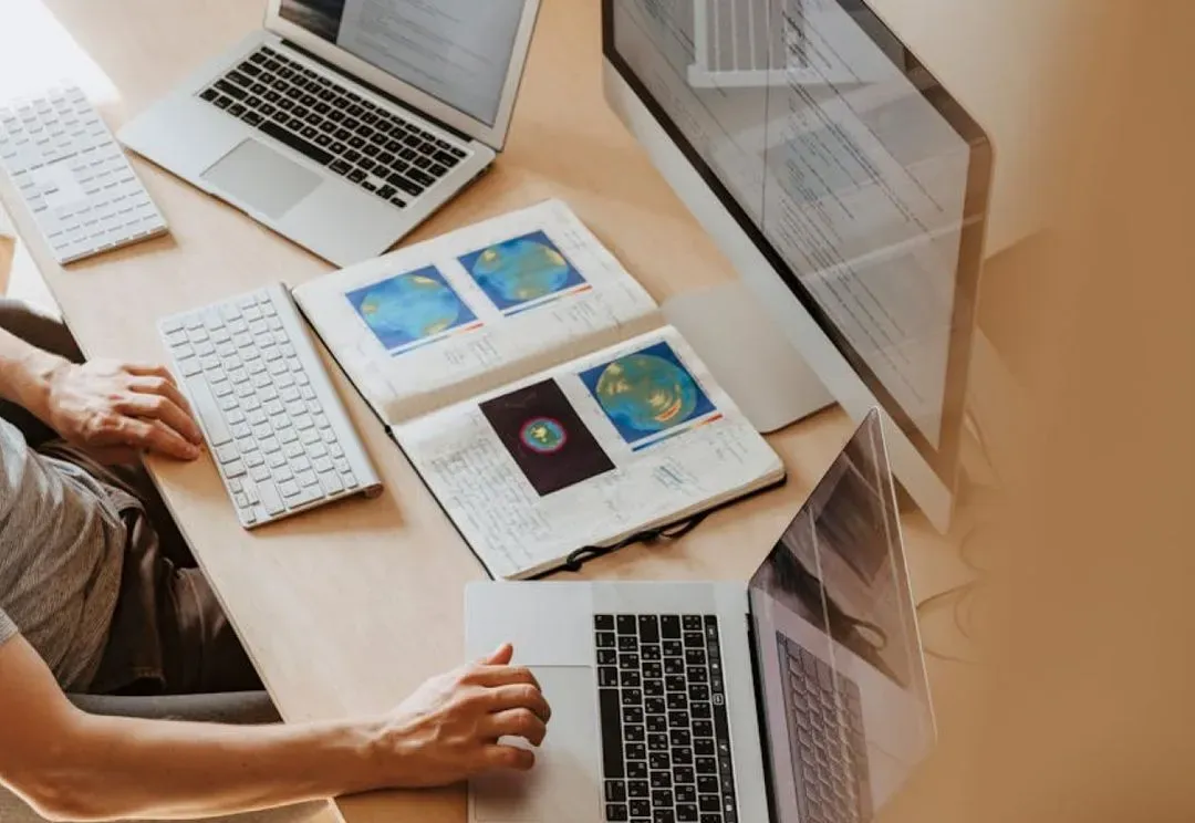 Person reviewing charts on laptop.