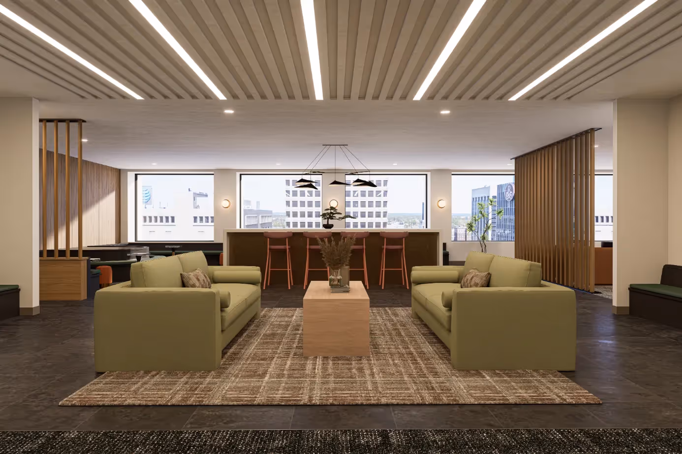 Luxurious resident lounge area with comfortable sofas and a modern bar setup, offering stunning city views from Continental Tower in Columbus, Ohio.