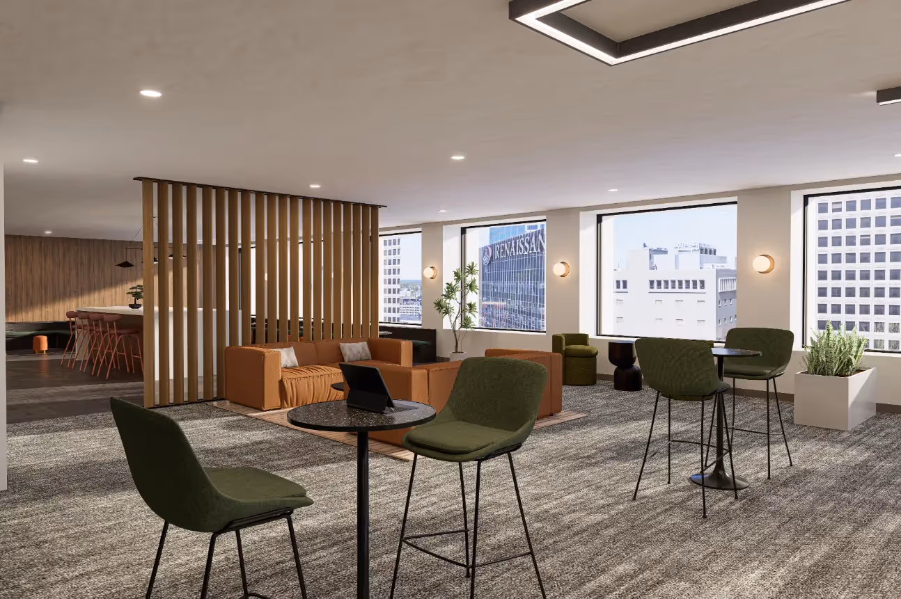 Stylish resident lounge and co-working space with various seating options, including a bar and tables, and city views, at Continental Tower in Columbus, Ohio.