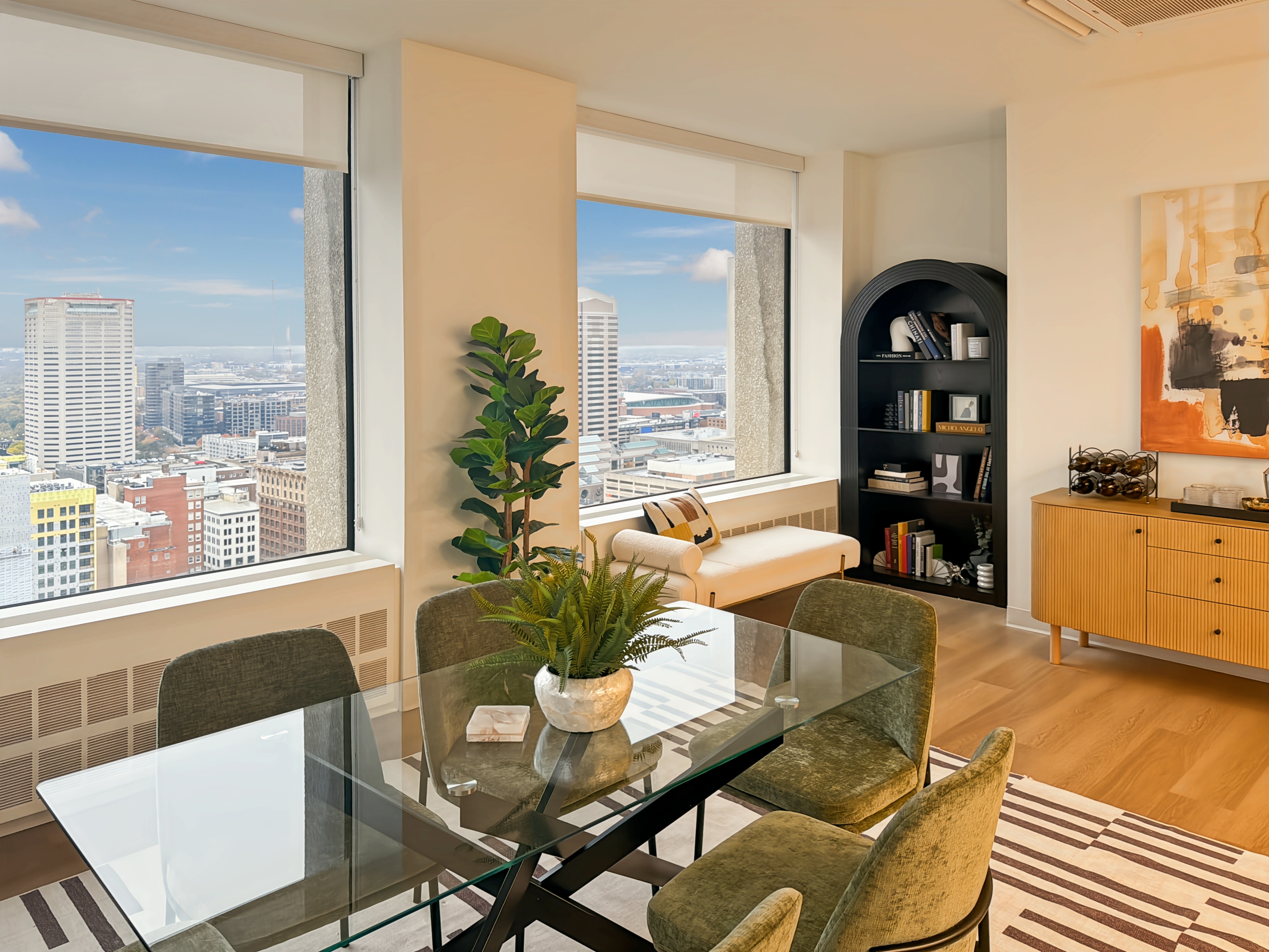 Modern bathroom with a spacious vanity, illuminated mirror, walk-in shower, and contemporary design at Continental Tower in Columbus, Ohio.