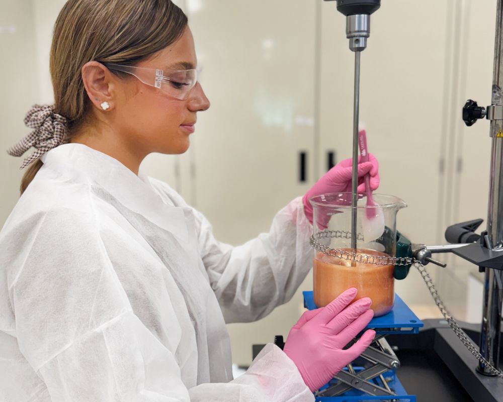 Photo of chemist creating a product