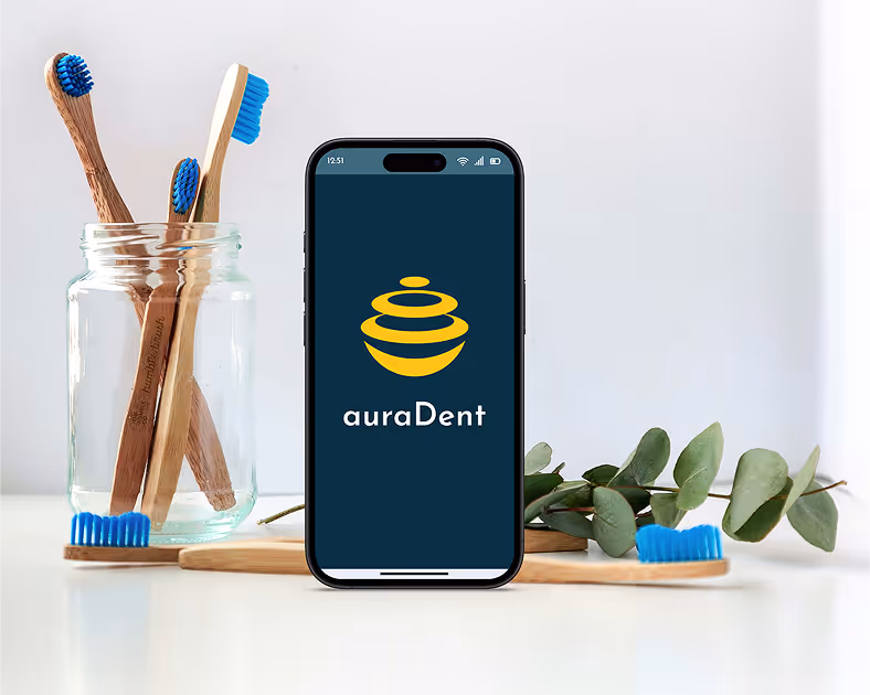 Mobile device showing logo screen of auraDent app, that assists dental anxiety sufferers
