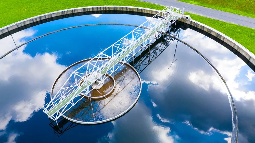 Aerial view of a circular water treatment clarifier tank