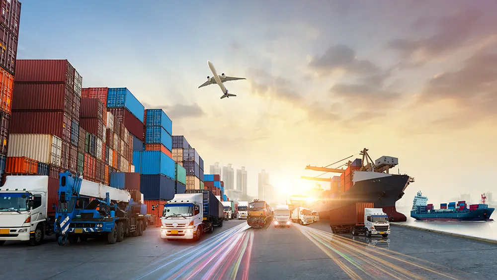 Shipping port with cargo containers, trucks and a cargo ship