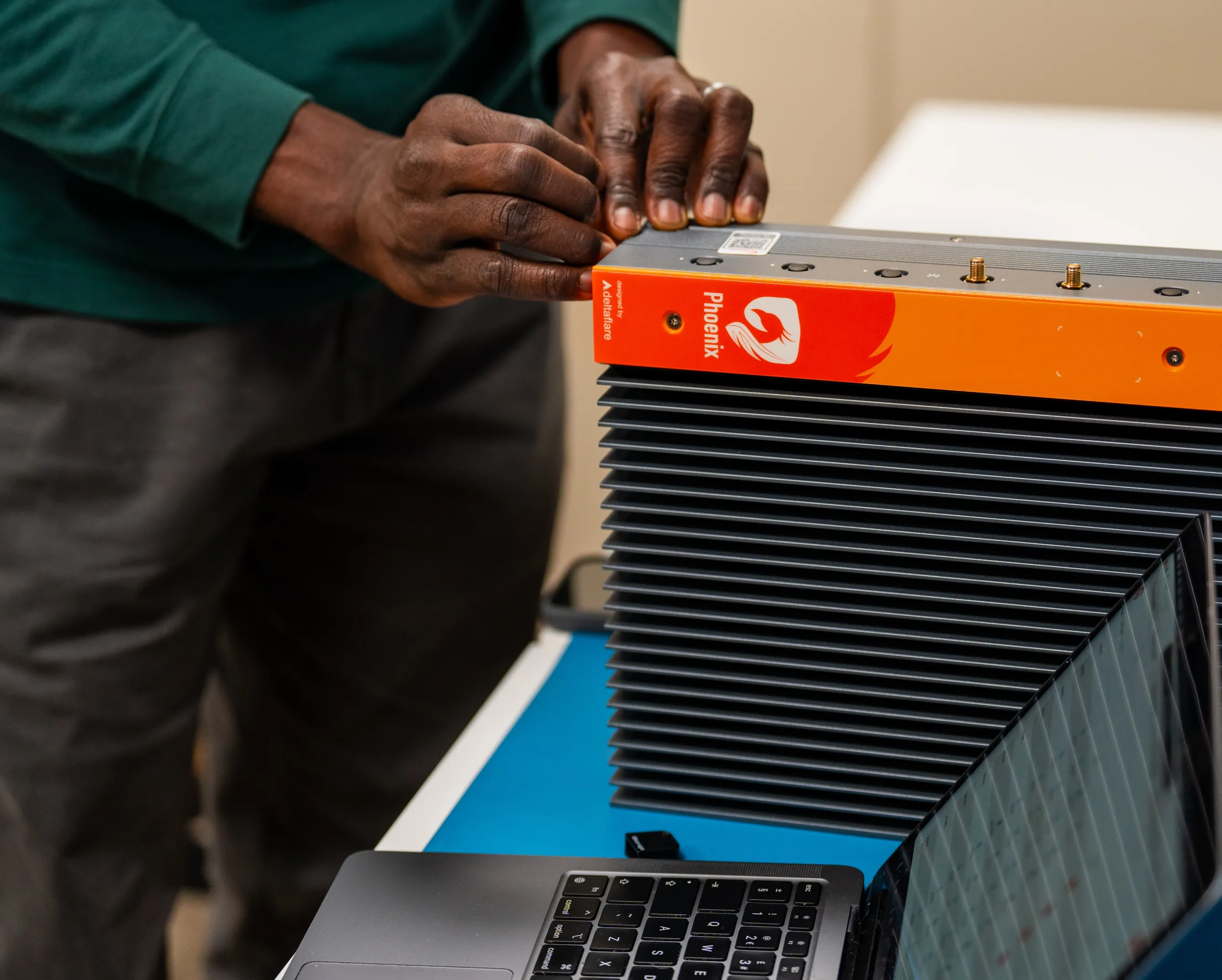 Technician installing a Phoenix hardware unit
